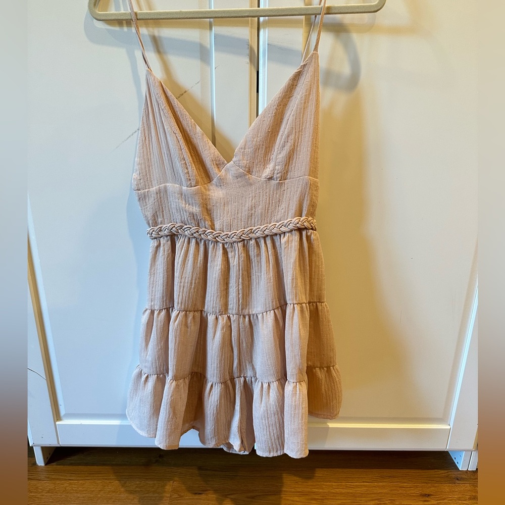 Never worn skort romper. Front is skirt back is shorts
